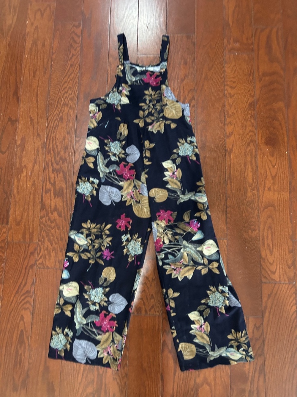 Women’s black floral jumpsuit overalls lightweight linen-like fabric.